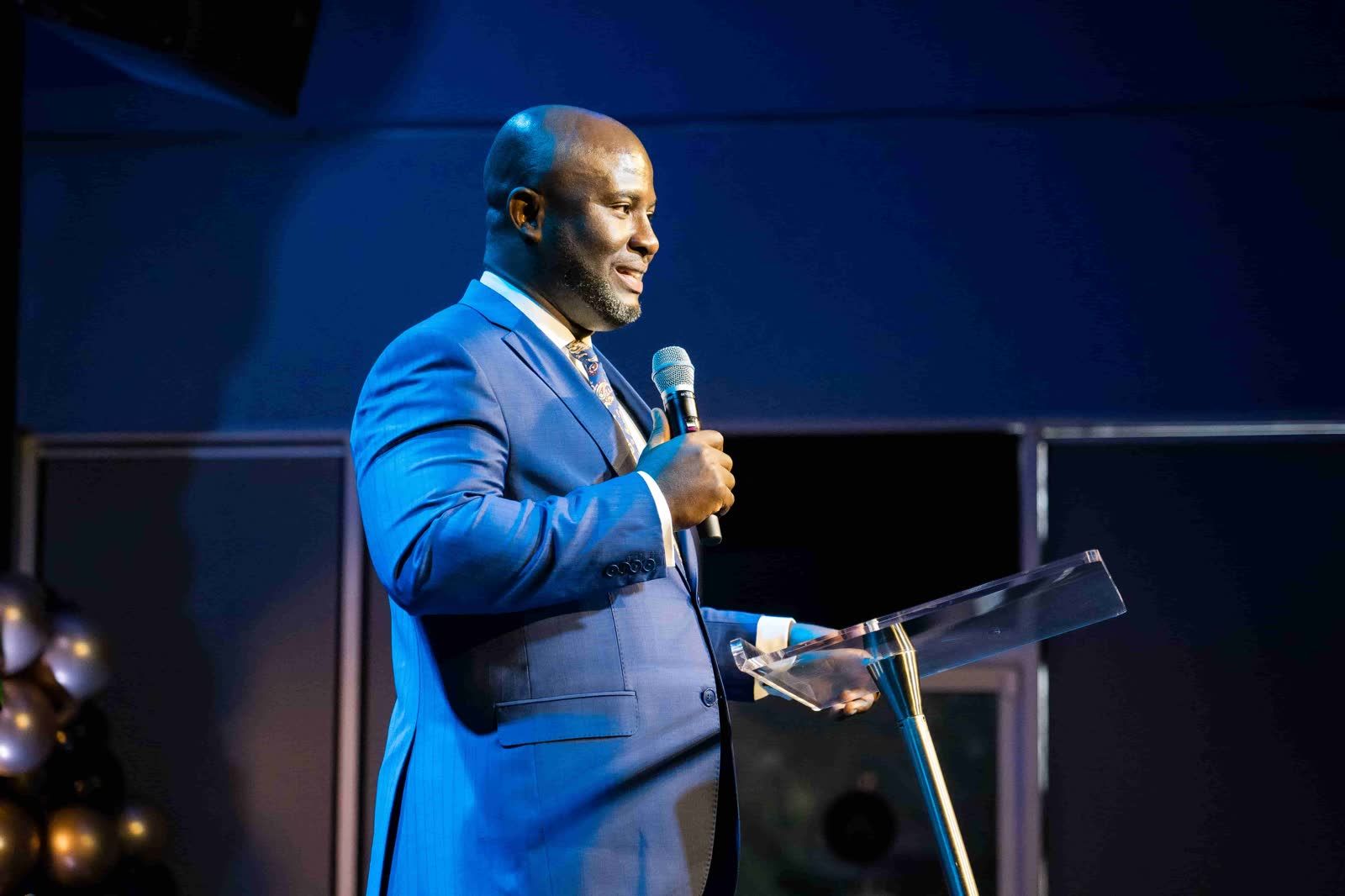 Pastor Timothy preaching at Realms of Glory